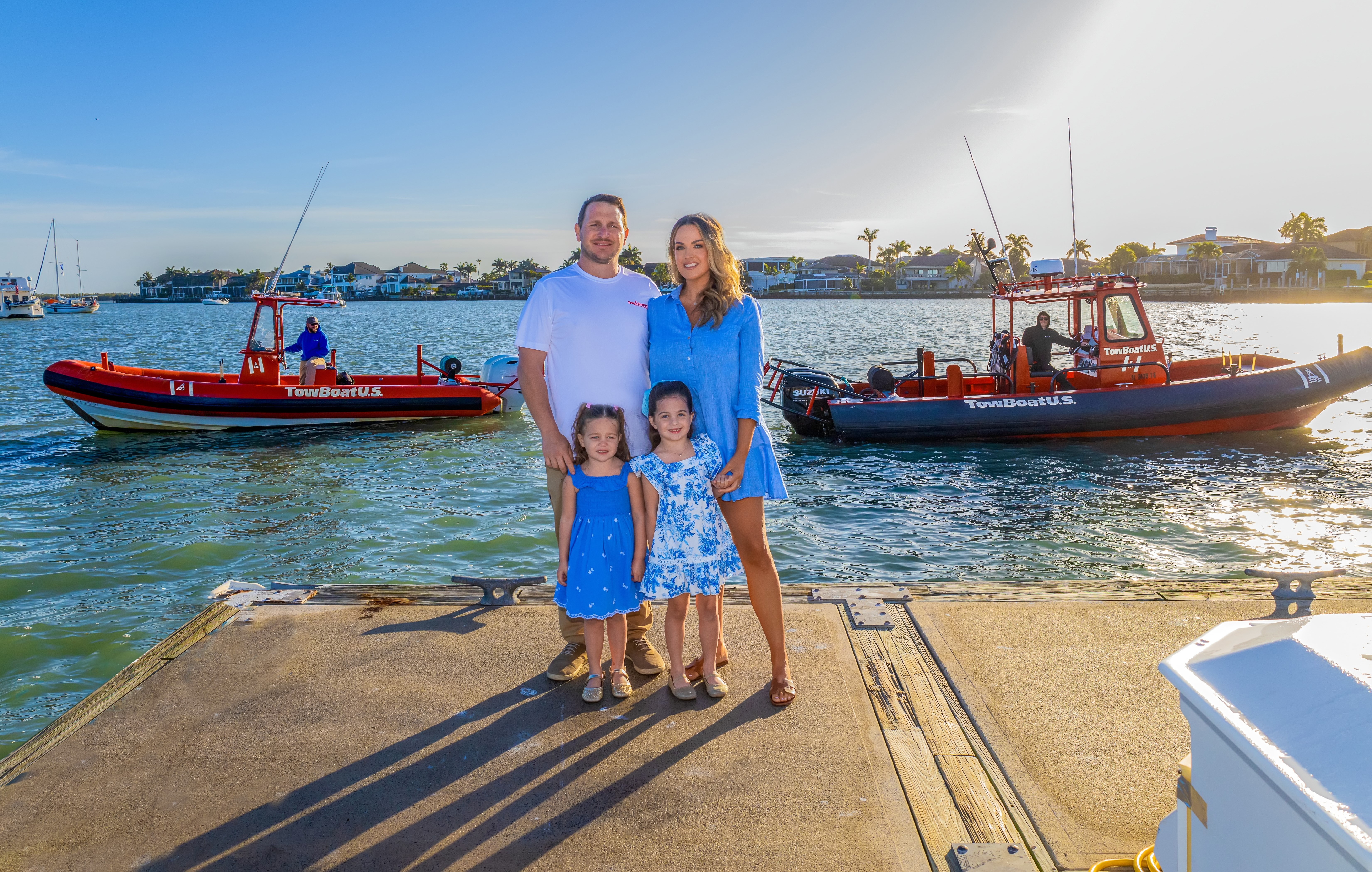 Capt. Todd and Dominique Dillman with family and TowBoatUS response vessels.